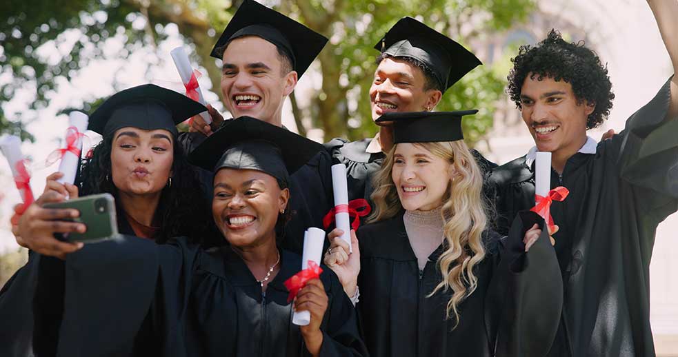 A happy group of graduate students gathering for a selfie