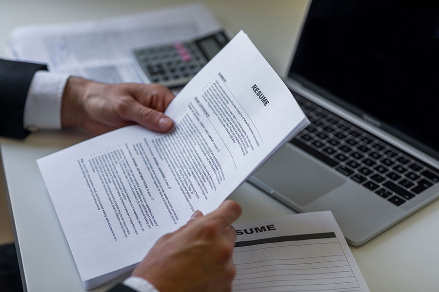 Businessman holding resume review to applying for job