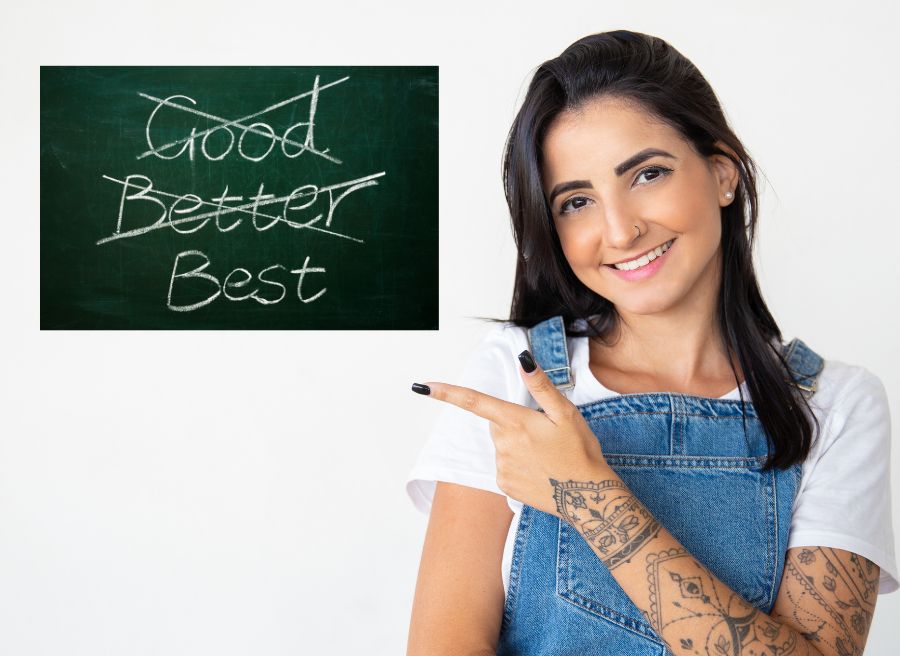 A smiling young woman points at a sign that reads best