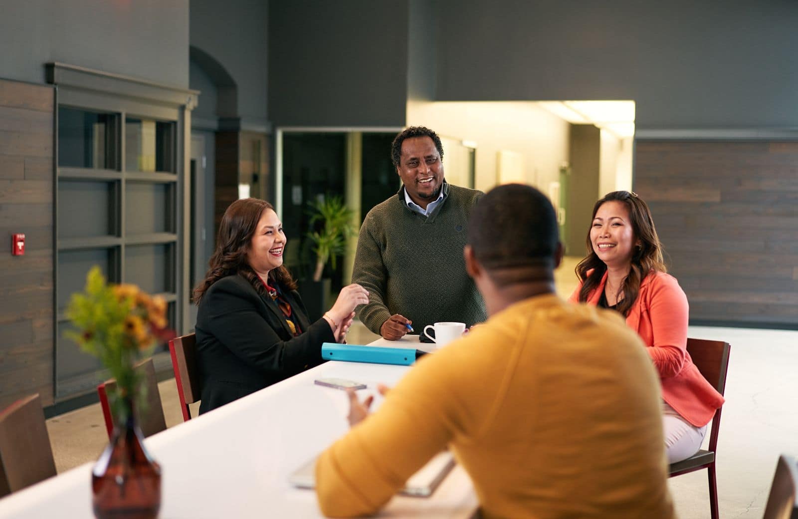 Four colleagues enjoying a conversation