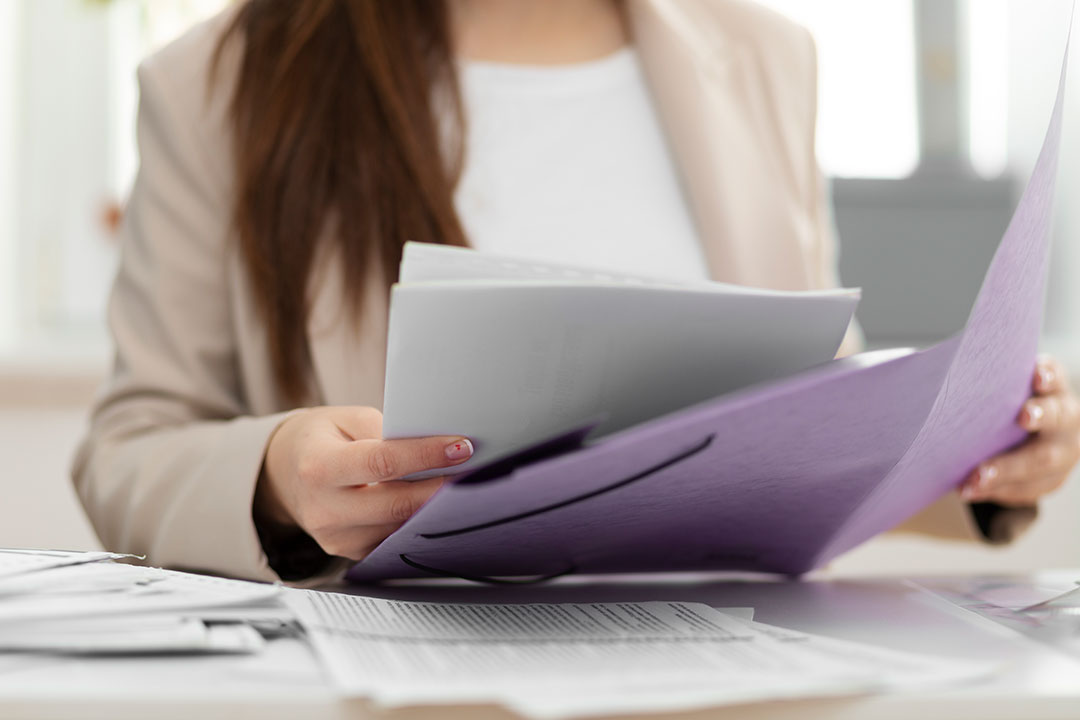 Woman holding documents